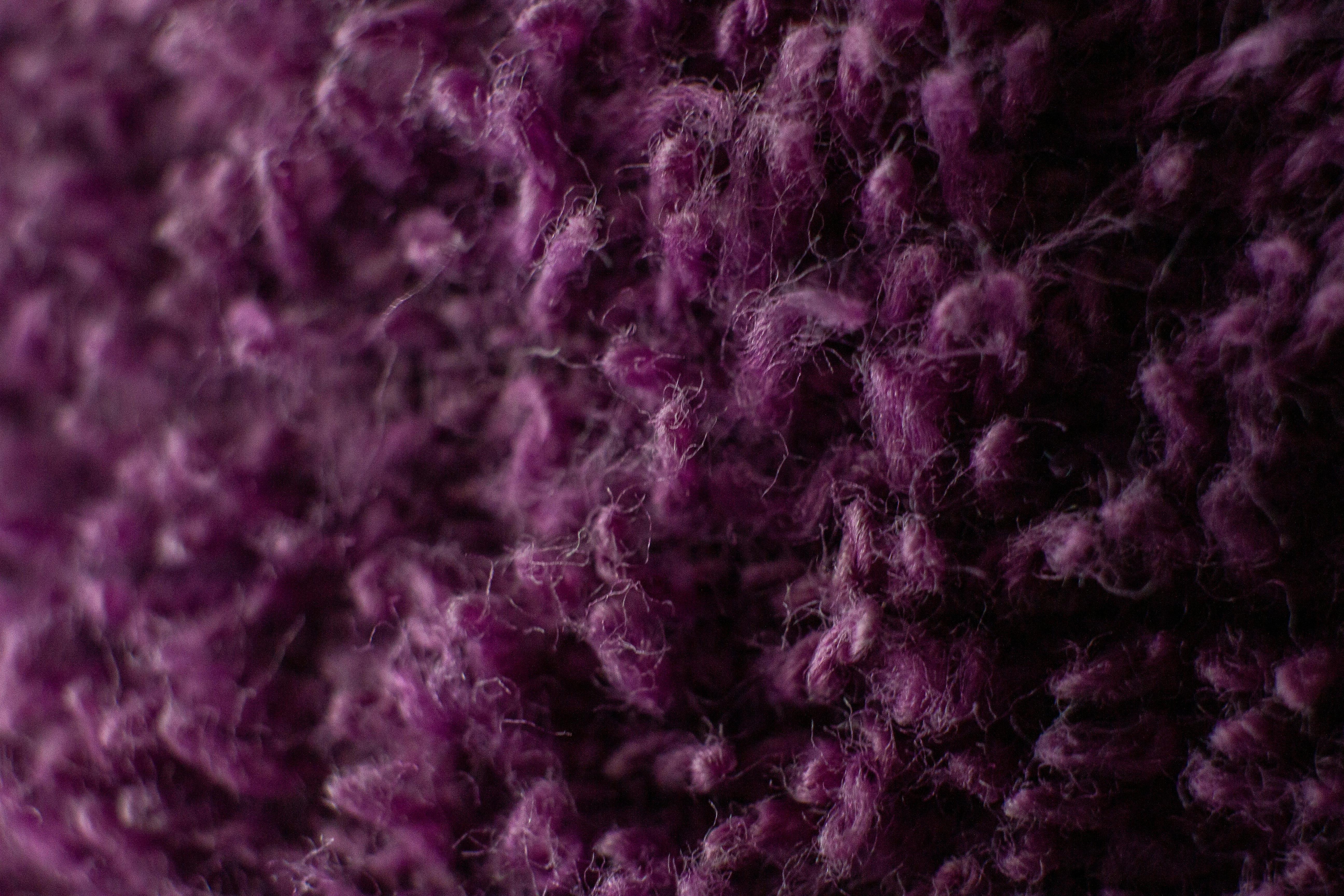 purple and white knit textile